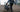 ADO Air 20S folding electric bike carried upstairs in a city environment, lightweight folding ebike designed for EU commuters and compact urban living